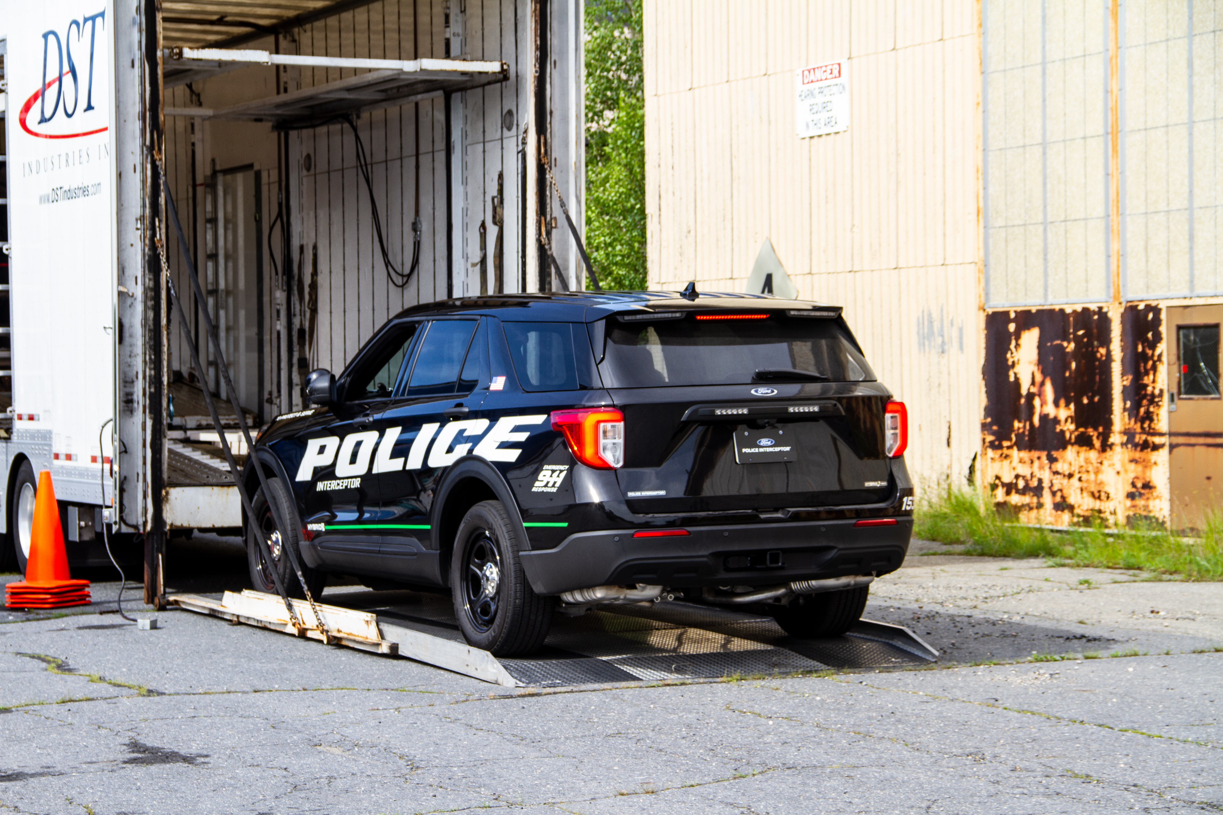 Hybrid Being Loaded Into a Transport Trailer